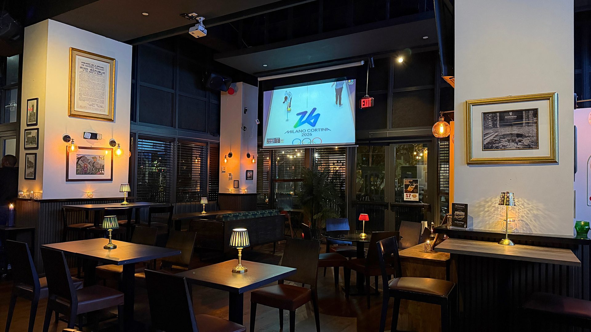 Private dining area at The Leinster with intimate table setup and projector screen