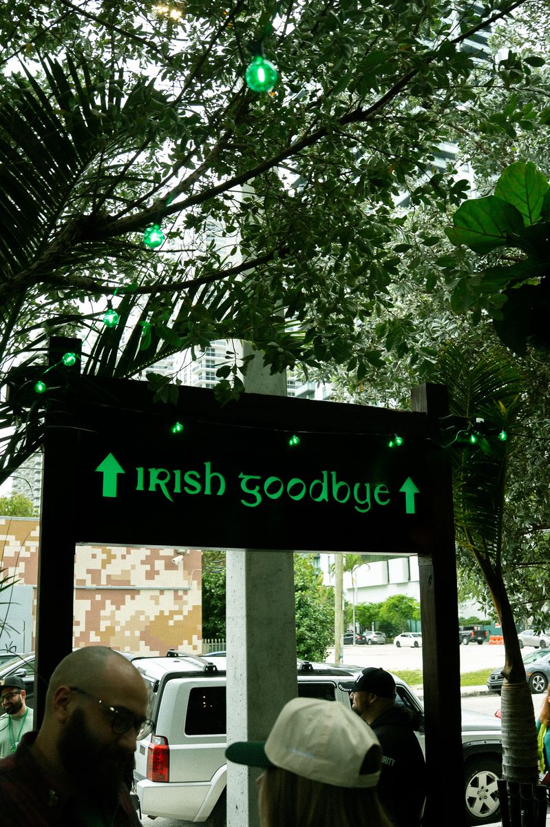 Irish Goodbye neon sign at the exit of The Leinster pub on St. Patrick's Day